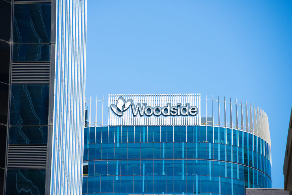 Photo of signage on top of the Woodside building in Perth, Western Australia.